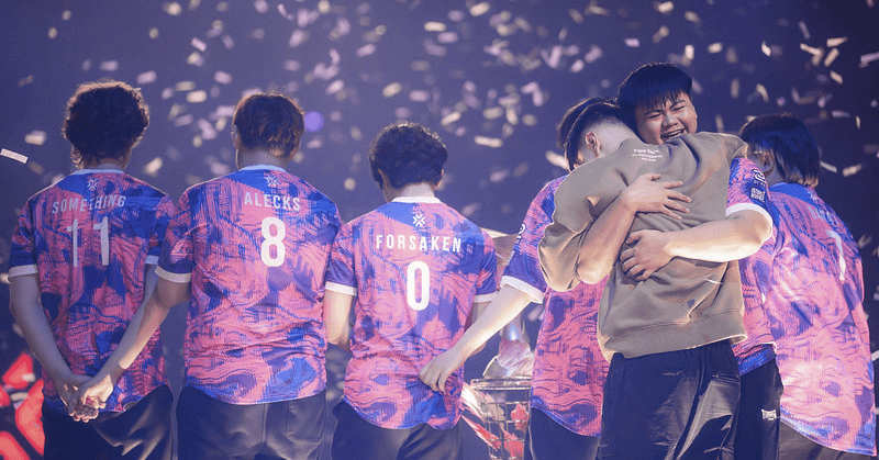 mindfreak and PatMen embrace on stage.